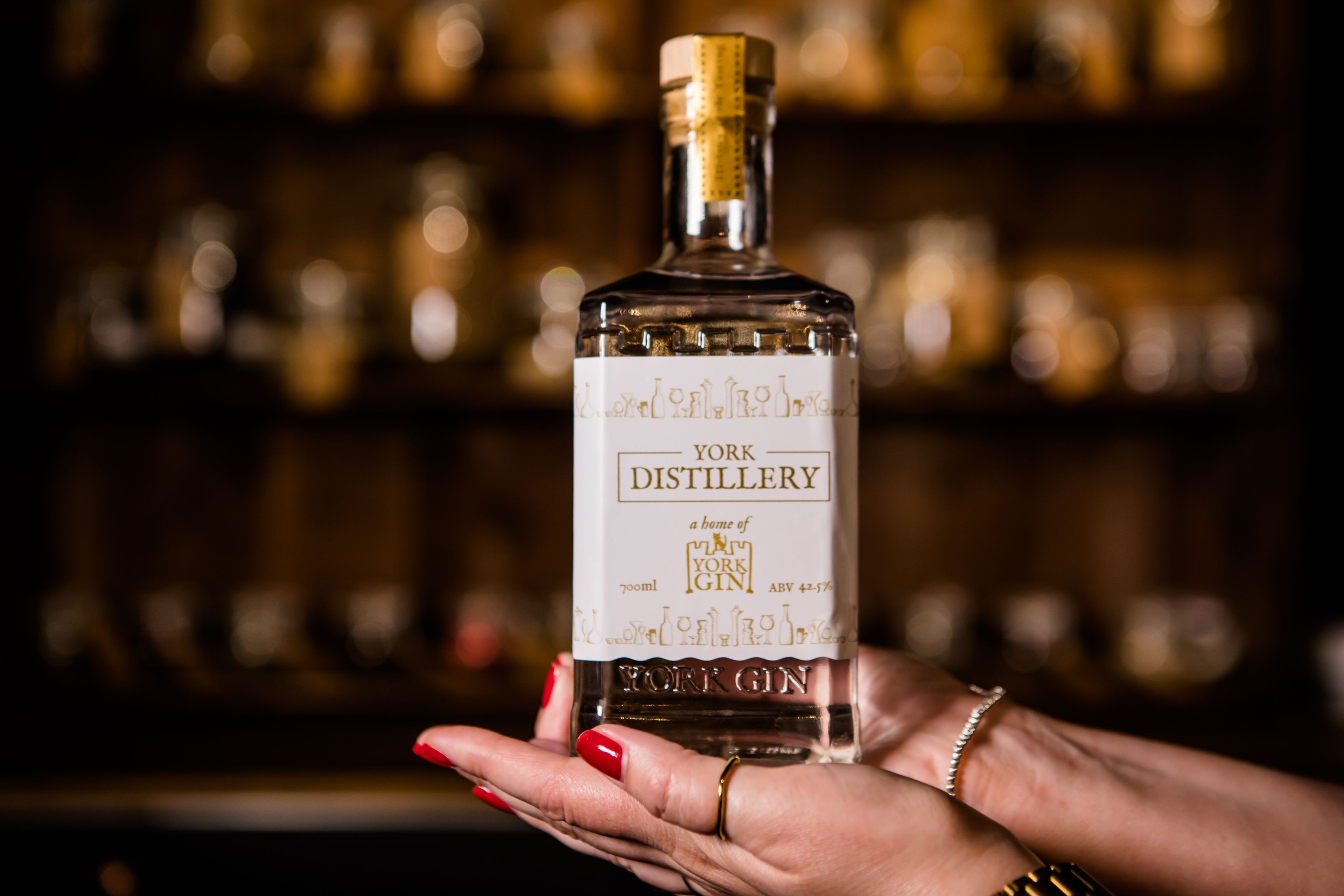 Hands holding York Gin