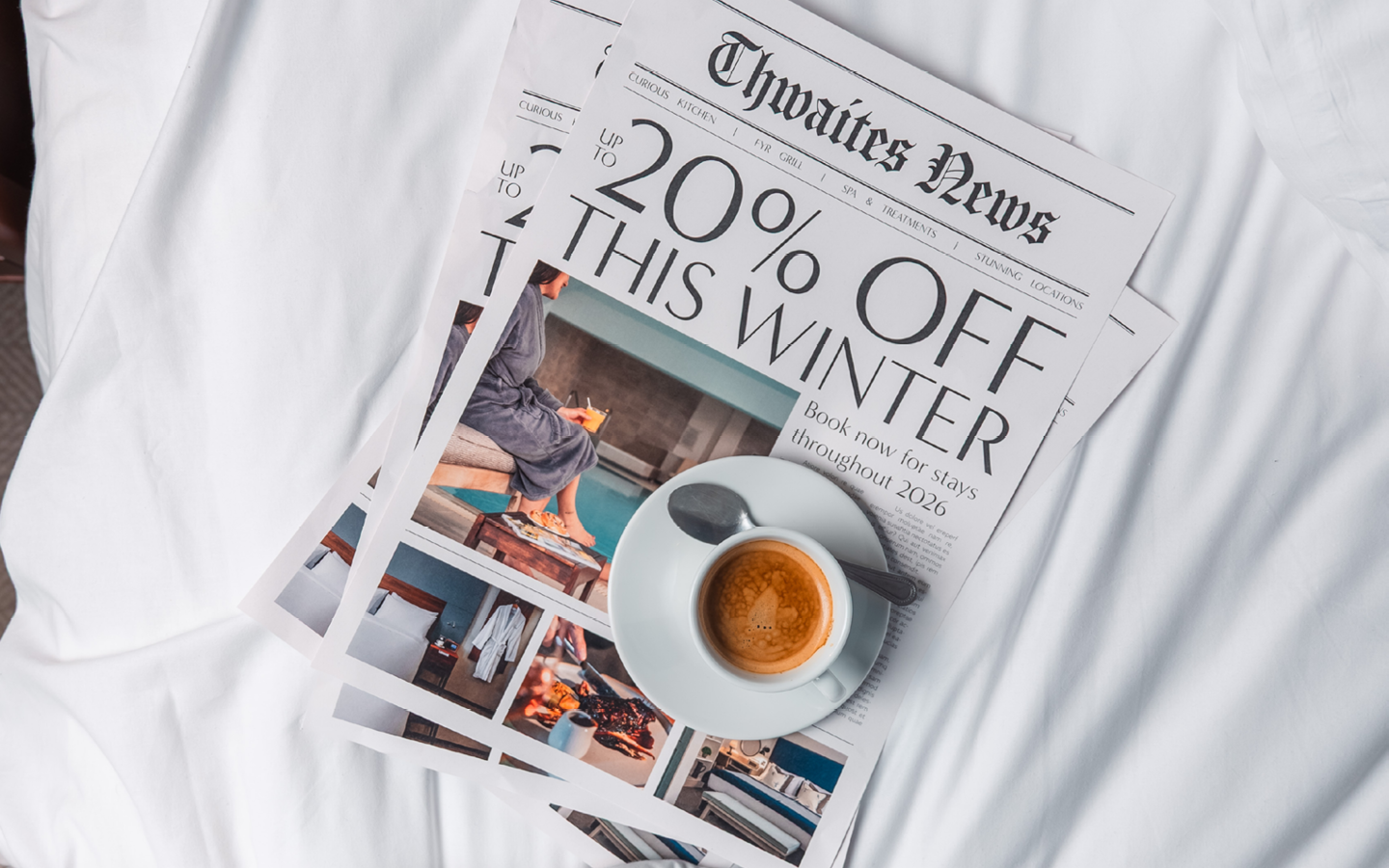 Newspaper on hotel bed with the headline "Up to 20% off winter sale"
