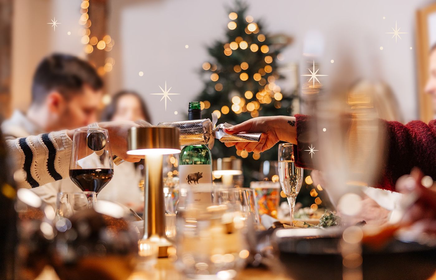 Cracker being pulled at Christmas meal