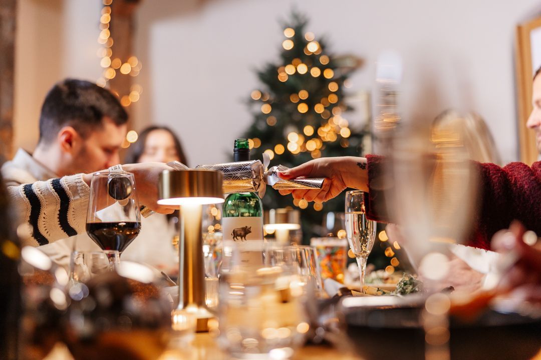 Cracker being pulled at festive meal